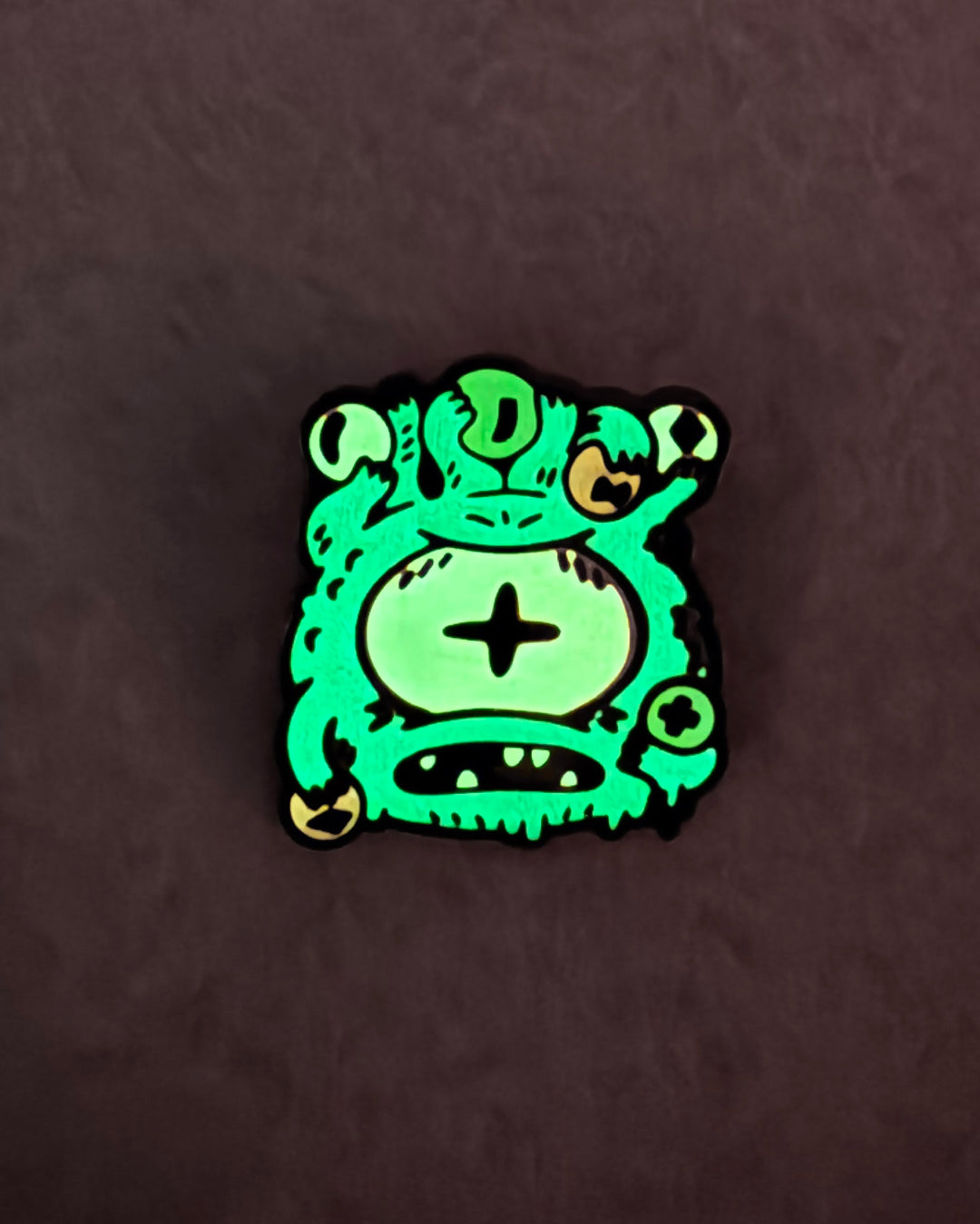 EyeHolder Enamel Pin (Glow Chase)